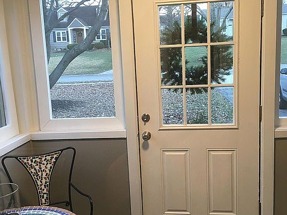 Screen porch. Patio furniture will stay.