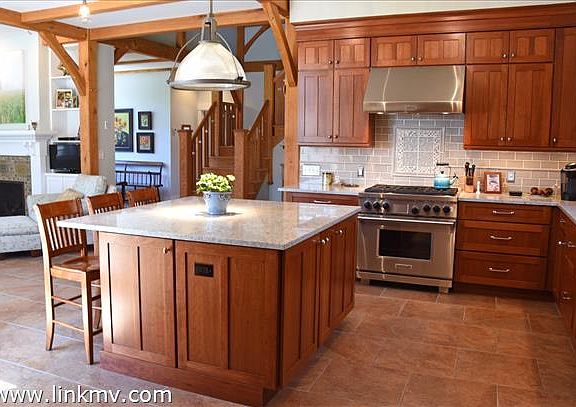 Chef's kitchen has custom cabinetry Wolf range and large sub zero refridgerator