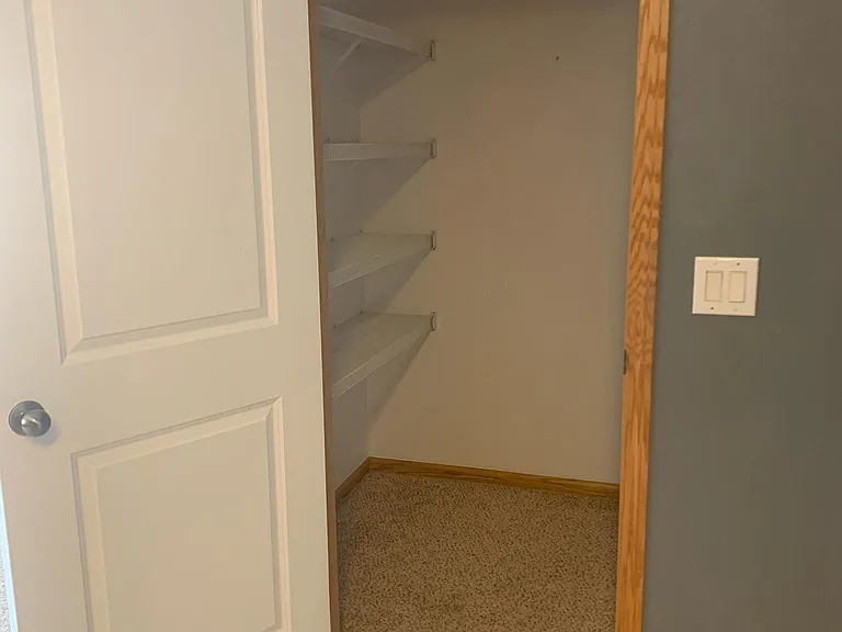 Walk-in kitchen pantry/coat closet.