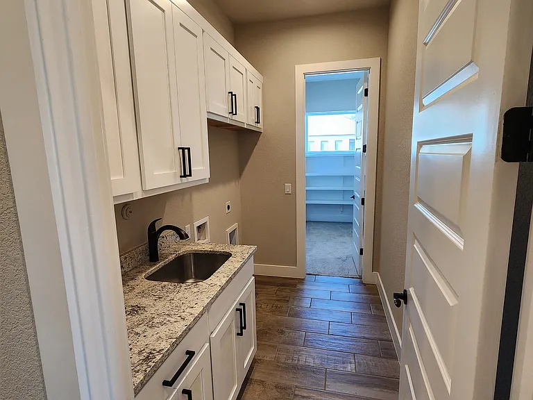 Laundry walk through Kitchen to Master BR
