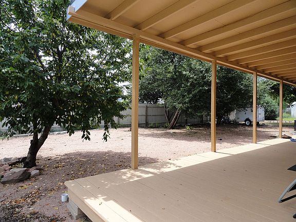 From under the deck into the yard