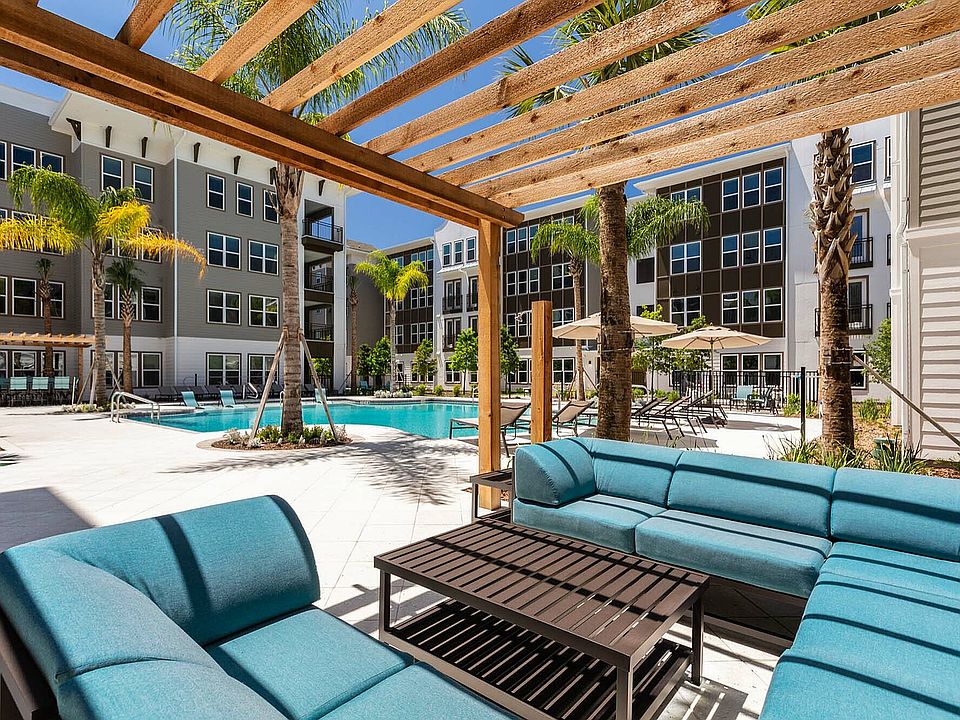 Relax in style with this luxurious poolside lounge area, perfect for sunny days and serene evenings.