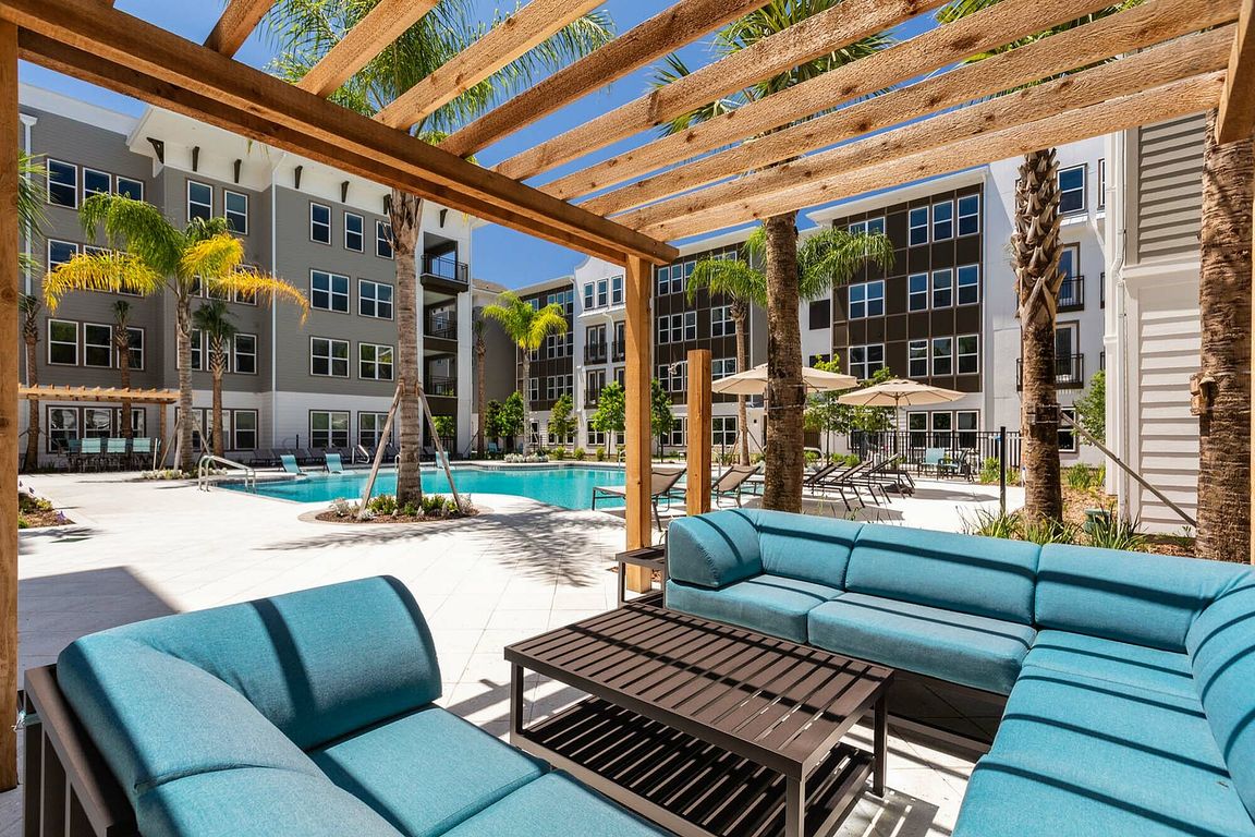Relax in style with this luxurious poolside lounge area, perfect for sunny days and serene evenings.