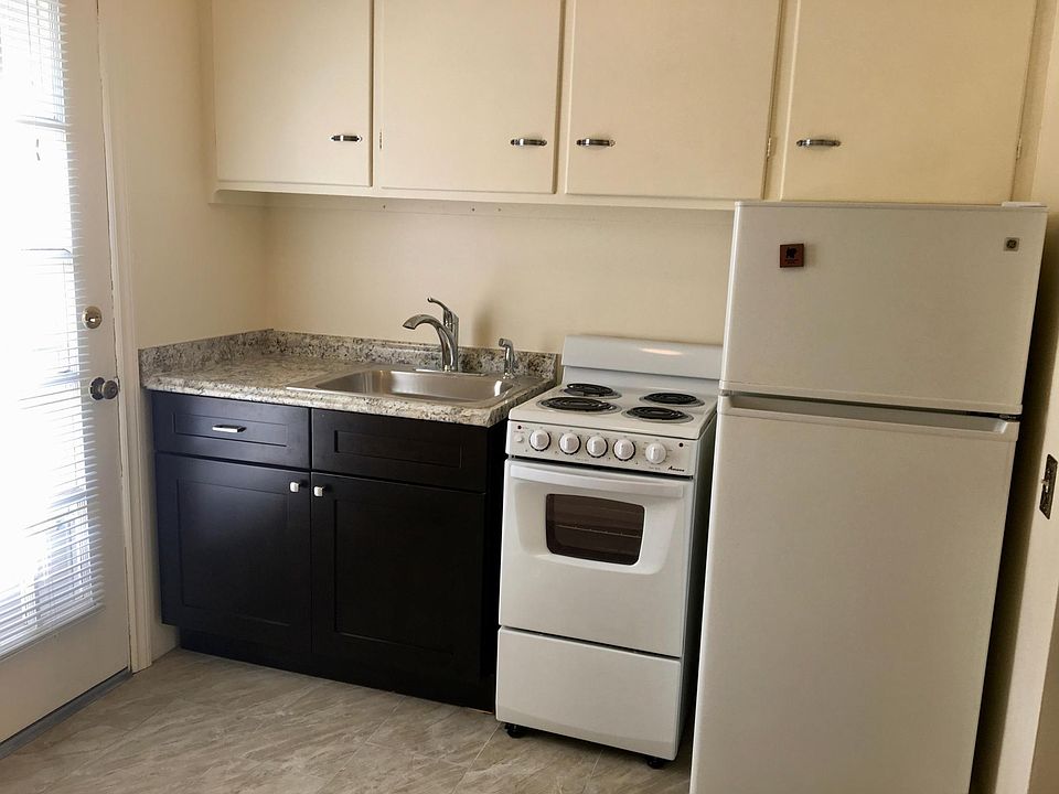 New sink/base, electric stove, ceramic tile.
