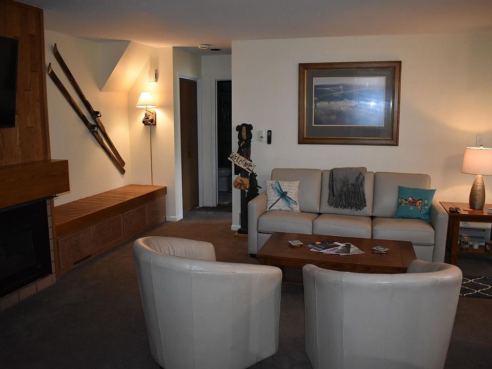 living area with large flat screen television.