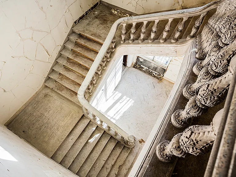 Before: Original ornate staircase from 2nd level looking down. You'll feel the history at Modera Sedici!