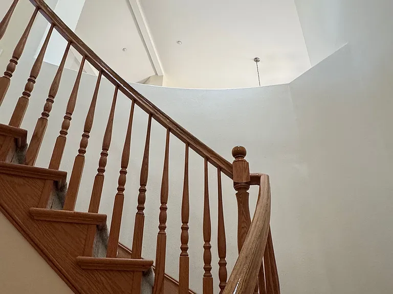 Stairway to downstairs bedrooms with skylight