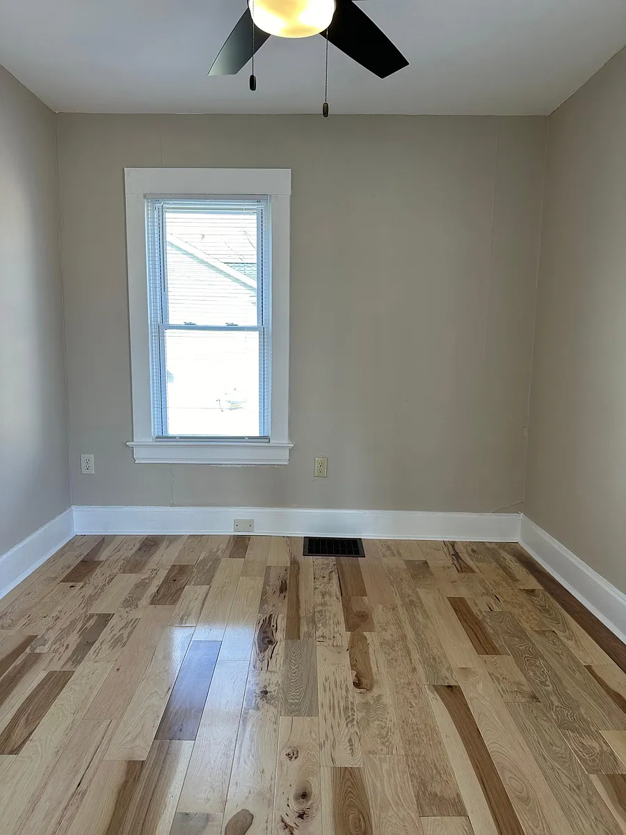 Living room wall - 317 E 8th St #UTILITIES PD