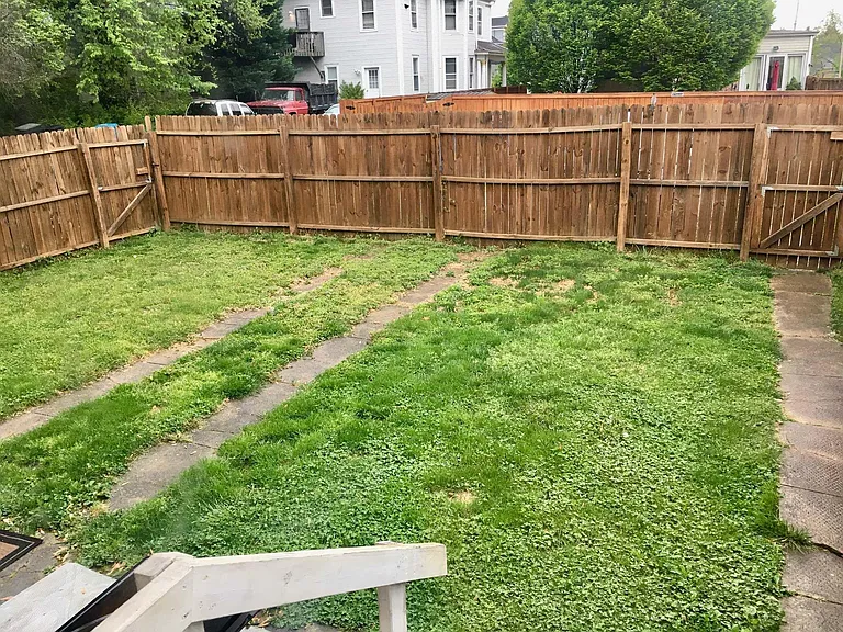 Shared Fenced In Backyard.