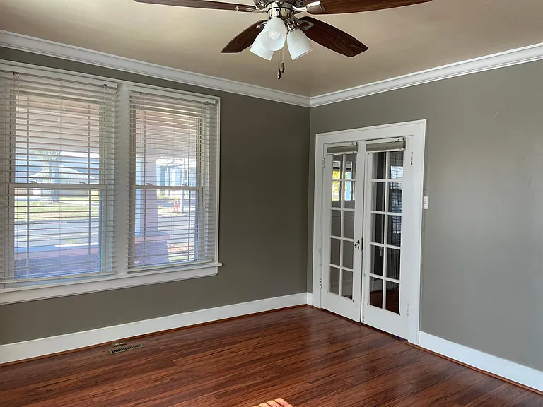 FRONT BEDROOM--DOUBLE DOORS LEAD TO LIVING ROOM