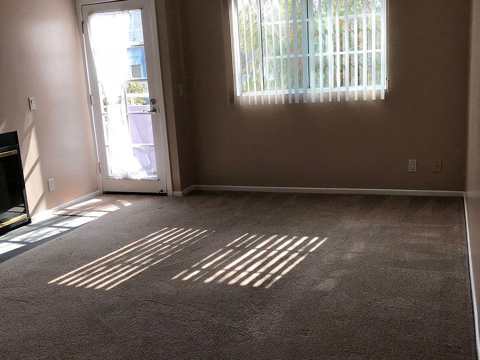 Living Room with patio access, double sided fireplace