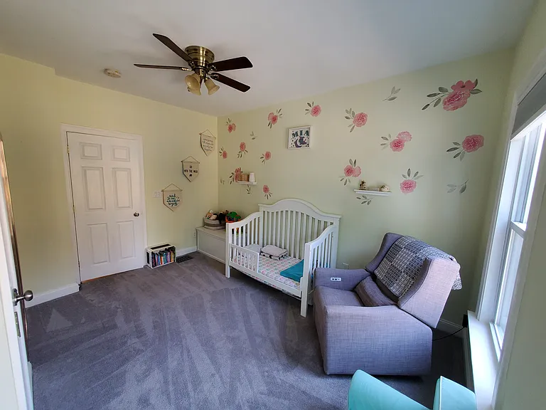 Bedroom 2 with walk in closet and ceiling fan