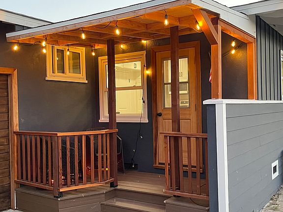 Side Porch is all new decking and carpentry - Great for morning coffee or just hanging out - Looks North to Maple Street