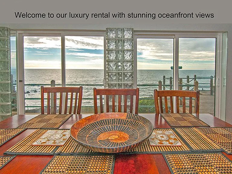View from dining room, floor to ceiling windows with perfect ocean view.