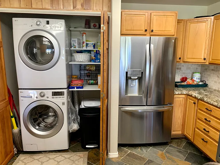 Stacked front loading washer dryer