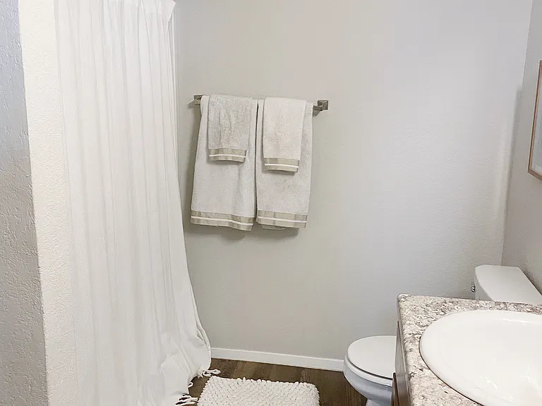 Primary bath has shower/tub combination.