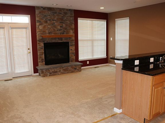 Second floor Kitchen looks into family room. Gas fireplace. 