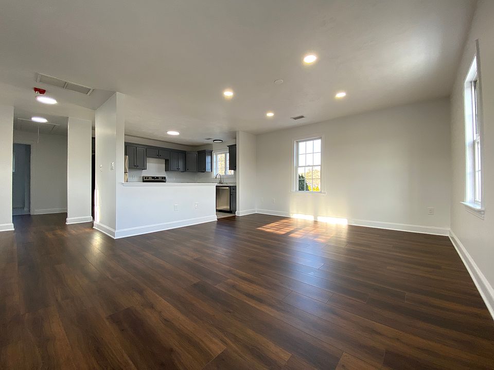 Sun drenched open concept main living area and kitchen