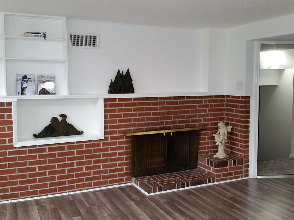 Main studio area showing fireplace and book shelves.