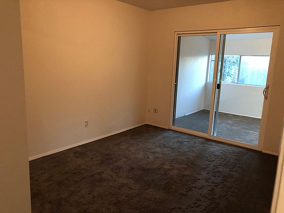 Bedroom 2 w/ sliding door to sun room