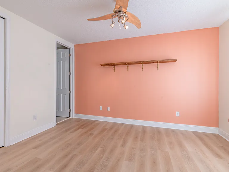 The second bedroom has an ensuite bathroom and ceiling fan!