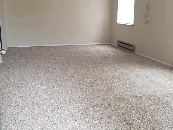 Large Living Area with new carpet.