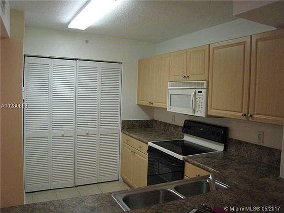 Every modern appliance in tiled kitchen