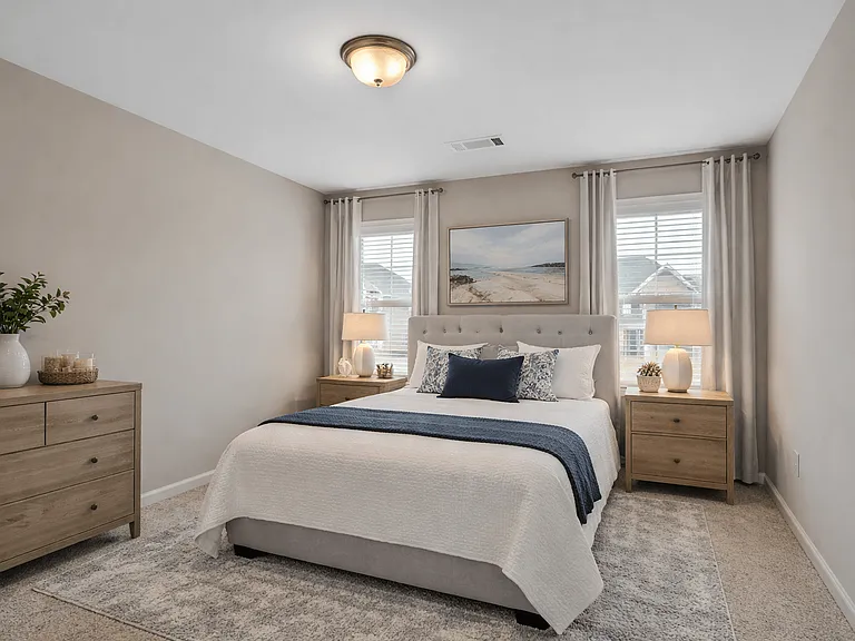 Guest bedroom featuring a queen bed