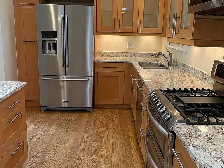 spacious open kitchen, gas stove and stainless steel appliances