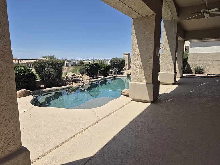 Pool on golf course looking west. City Light views at night