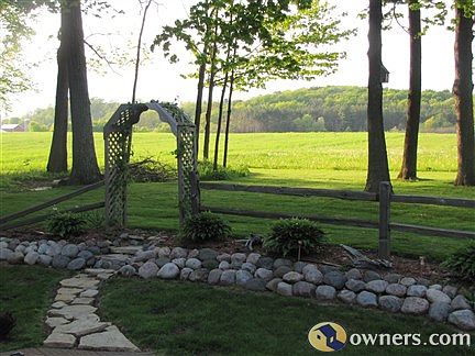 FULLY WOODED LOT WITH LANDSCAPING