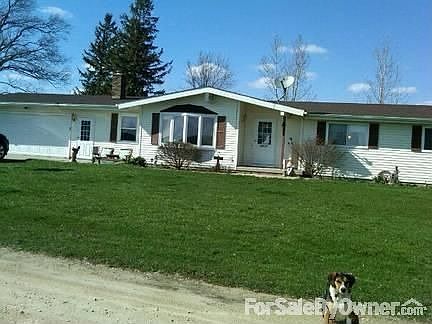 Front of house
						:
						Large landscaped yard. In the summer there are bushes, trees and flowers.