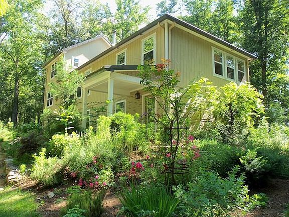 Beautiful landscaping surrounds the home 