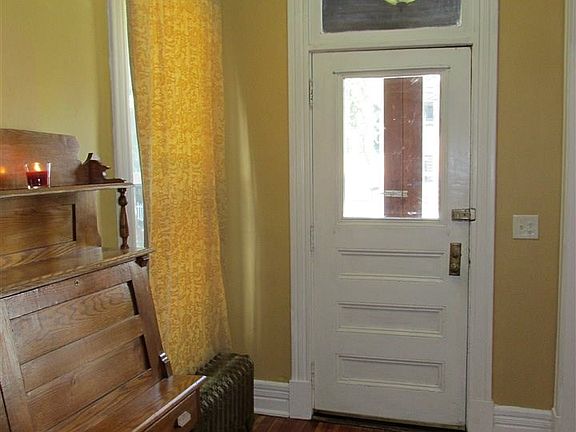 Wood floor, transom window over door, updated lighting.