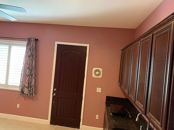 living room with kitchen side view