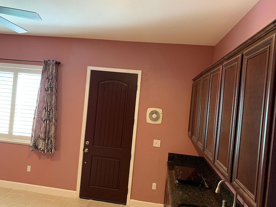 living room with kitchen side view