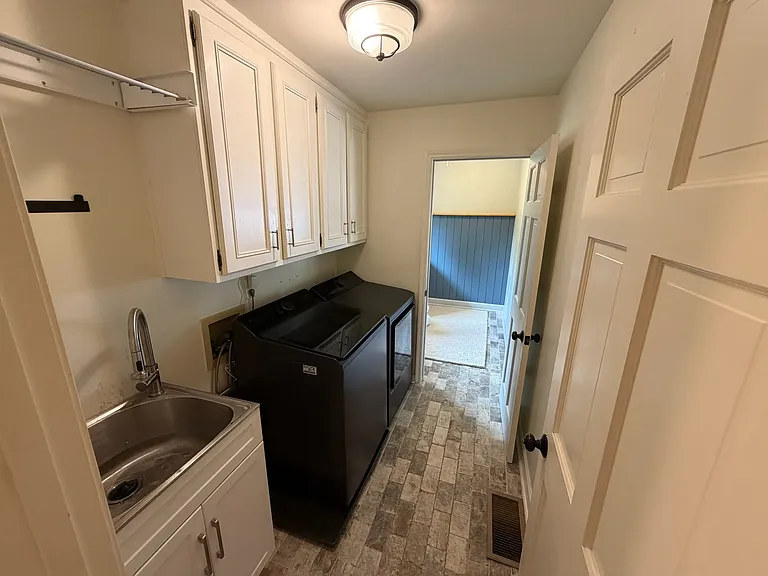 Laundry with washer, dryer and utility sink