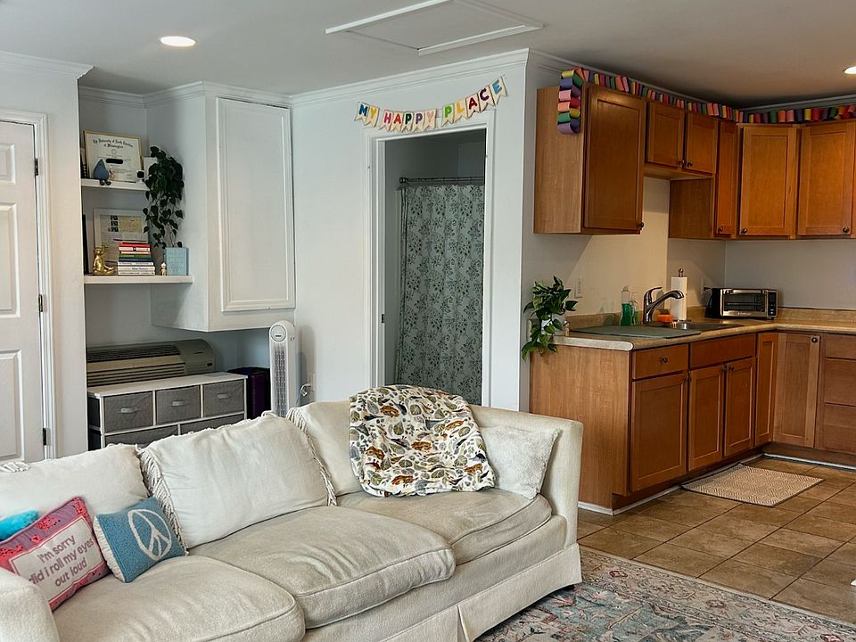 Bright open-concept living area with cozy seating and a fully equipped kitchen. A welcoming, spacious spot to relax, cook, and unwind after a day out.