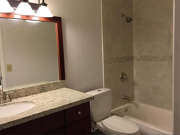 Bathroom Remodeled New Tile Work and New Cabinets with Grani