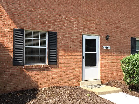 You may plant approved plants in flower beds by your door..