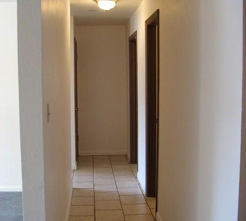 hallway with easy clean, cool ceramic tile