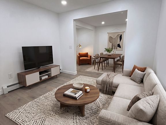 Living- This room has been virtually staged using AI to help visualize its layout and design potential.