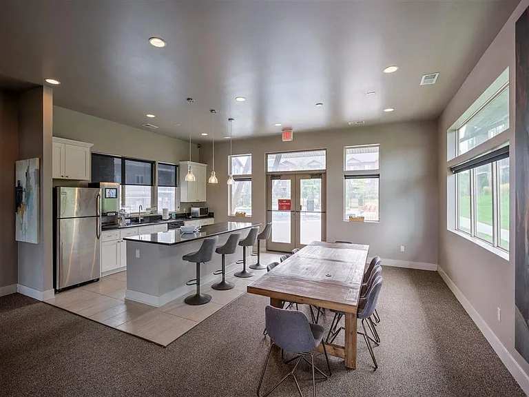 Community kitchen with pool area entrance in clubhouse at Avenue 204.