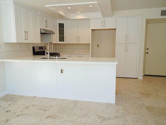Kitchen opens to dining area