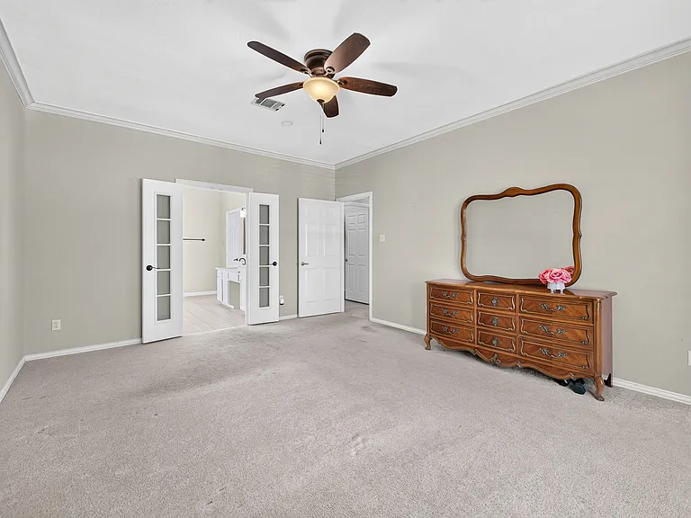 Primary Bedroom with bay window and vaulted ceiling