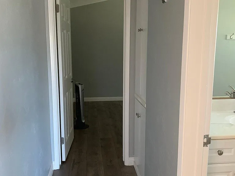 Hallway to upstairs bedroom #1; bathroom on the right