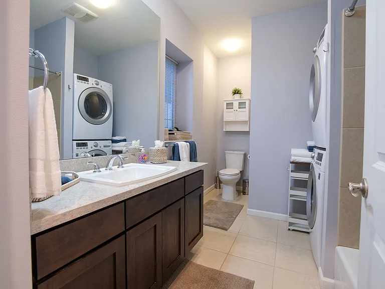 Bathroom with full size washer and dryer
