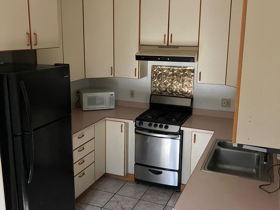 Kitchen with lazy susans in each corner cabinet! New Fridge
