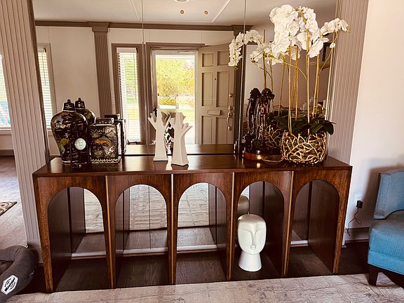 Entry when you walk in the front. Wall of glass perfect for your console table and art.