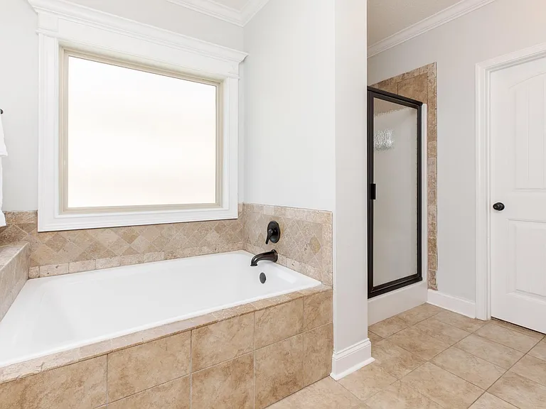 Master Bathroom w/walk in shower and tub.